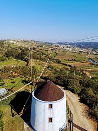 Scenic view of land against clear blue sky