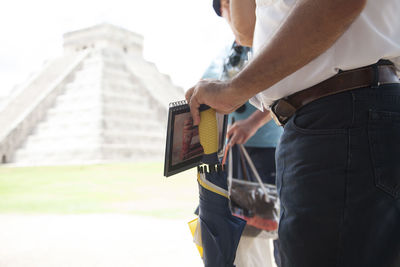 Close-up of woman holding camera