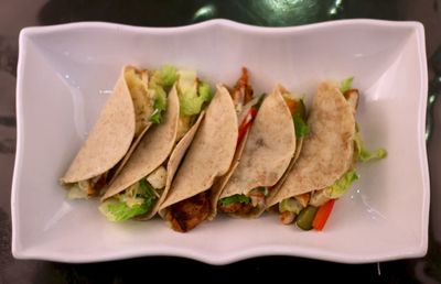 Directly above shot of tacos in plate on table