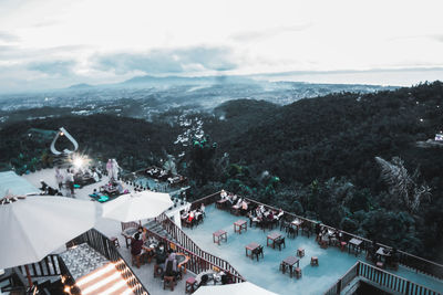 High angle view of people on mountain against sky