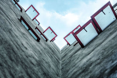 Low angle view of communications tower against sky