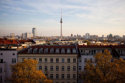 Fernsehturm in city against sky