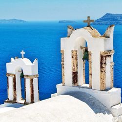 Blue mosque by sea against sky
