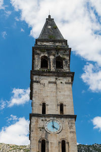 Low angle view of clock tower against sky