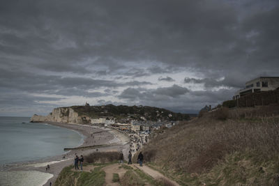 Built structures against cloudy sky