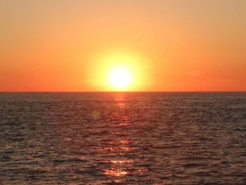 Scenic view of sea against clear sky during sunset