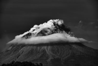 Scenic view of volcanic mountain against sky