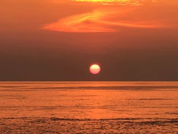 Scenic view of sea against romantic sky at sunset