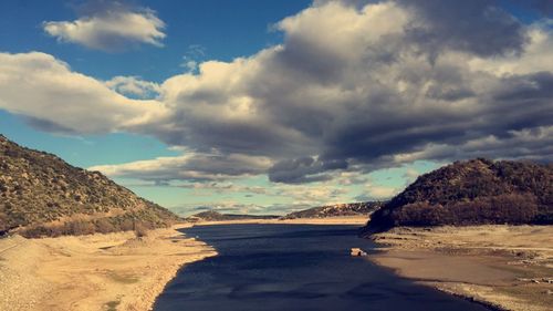 Scenic view of sea against cloudy sky