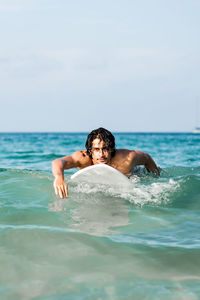 Young man swimming in pool