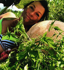 Portrait of woman against plants