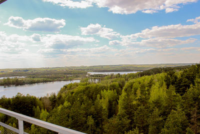 Scenic view of lake against cloudy sky