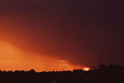 Silhouette of built structure at sunset