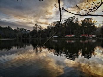 Scenic view of lake against sky at sunset