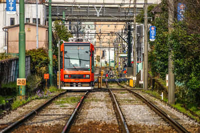 Train on railroad track in city