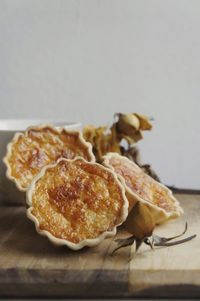 Close-up of food against wall on table