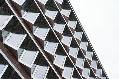 Low angle view of modern building against clear sky