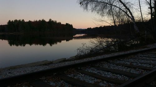 Scenic view of calm lake at sunset