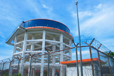 Low angle view of ferris wheel against sky