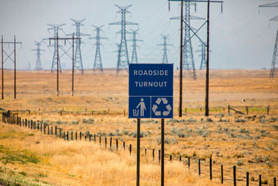 Information sign on field by road