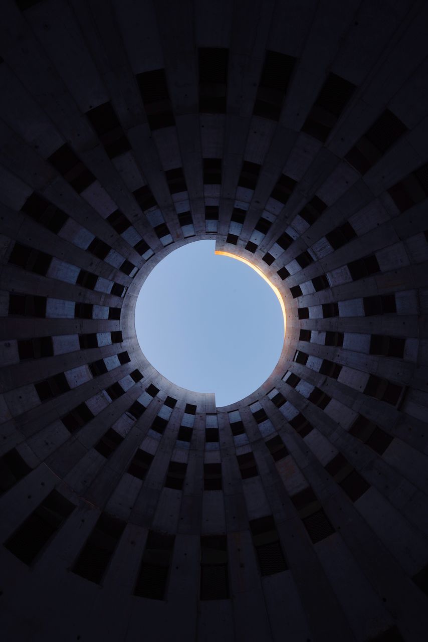 architecture, built structure, geometric shape, no people, pattern, low angle view, circle, shape, indoors, sunlight, directly below, building, sky, window, day, design, nature, ceiling, full frame, skylight, cupola