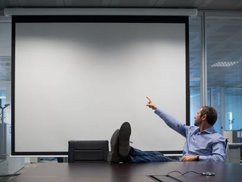 Rear view of man working in office