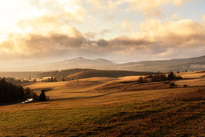 Scenic view of landscape against sky during sunset