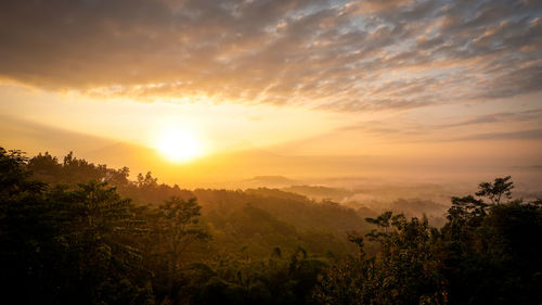 Scenic view of landscape against sky during sunset