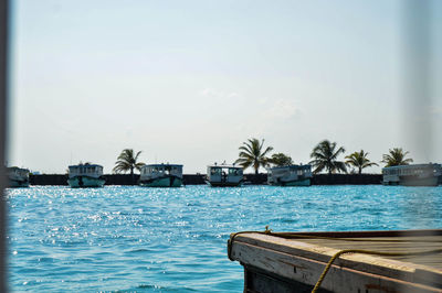 Swimming pool by sea against sky