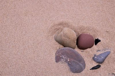 High angle view of stones on sand