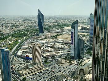 High angle view of modern buildings in city against sky