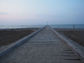 Scenic view of beach against sky during sunset