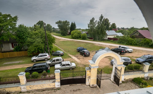 High angle view of cars on street against sky