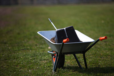 Coin-operated binoculars on barbecue grill in yard