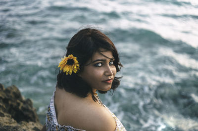 Portrait of woman against sea