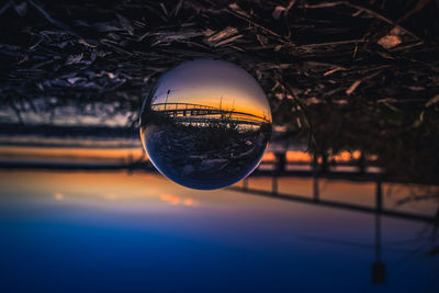 Close-up of crystal ball on glass