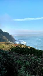 Scenic view of sea against blue sky