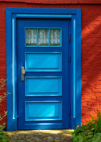 Closed blue door of house