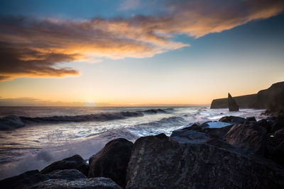 Scenic view of sea against sky during sunset