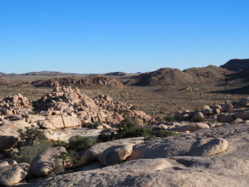 Scenic view of rocky mountains against clear sky