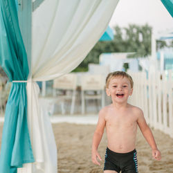 Portrait of smiling boy on beach