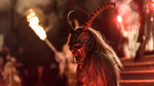 Low angle view of man during halloween at night