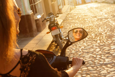 Rear view of woman with bicycle