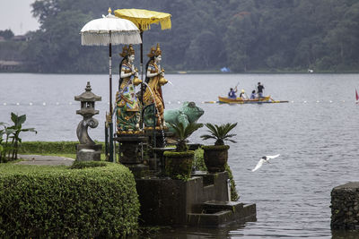 Group of people in park by lake