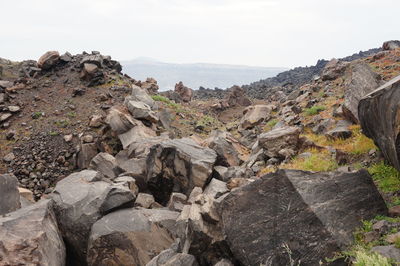 Rock formations on landscape against sky