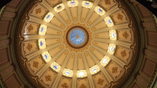 Low angle view of illuminated ceiling