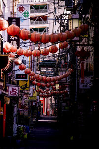 Clothes hanging in market stall in city