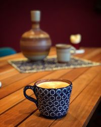 Close-up of coffee cup on table