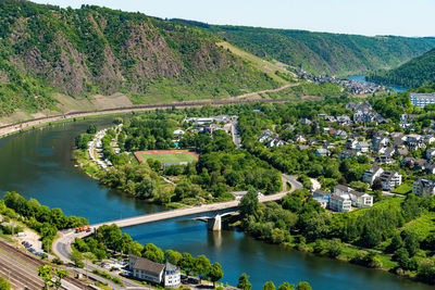 High angle view of river amidst trees in city