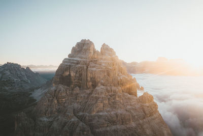 Rock formations on landscape against clear sky